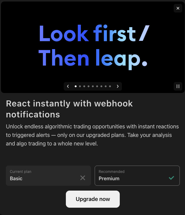 Screenshot from a TradingView Basic (free) account in July 2026 showing the upgrade dialog for webhook notifications, which says you can react instantly with webhooks only on the upgraded plans, with the Basic plan marked as not included